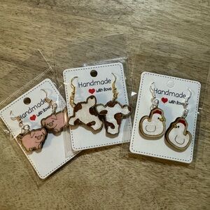 Wooden handmade earrings selling at 3 for 4$ Farm animals. Very cute.